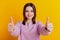 Photo of young attractive lady show thumbs-up promotion advert great isolated over yellow color background