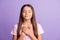 Photo of young attractive schoolgirl happy smile hands on chest dream dreamy wish pray isolated over purple color