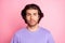 Photo of young attractive serious multiethnic guy wear casual outfit isolated over pink color background