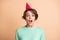 Photo of young attractive woman amazed excited surprised party wear birthday hat isolated over pastel color background