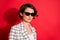 Photo of young attractive woman confident serious wear sunglasses gorgeous isolated over red color background