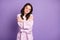 Photo of young attractive woman dream dreamy hug cuddle herself calm cozy isolated over purple color background