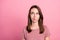 Photo of young attractive woman think hmm deep idea look empty space isolated over pink color background