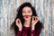 Photo of young beautiful funky attractive girl with fake mustache enjoying party isolated on glittered background