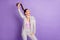 Photo of young beautiful funky funny good mood businesswoman dancing pull ponytail isolated on purple color background