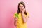 Photo of young beautiful scared nervous stressed girl bite fingers hold cellphone isolated on pink color background