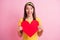 Photo of young beautiful smiling ecstatic positive girl hold present big red heart isolated on pink color background