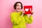 Photo of young blogging amazed woman in knitted pullover holding red cube button plus one like content isolated on pink
