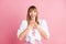 Photo of young cheerful attractive woman happy positive smile hands on chest surprised grateful isolated over pink color