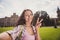 Photo of young cheerful girl happy positive smile make selfie show peace cool v-sign trip weekend outdoors