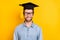 Photo of young cheerful man happy positive smile wear mortarboard student master isolated over yellow color background