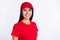 Photo of young cheerful smiling lovely beautiful service delivery woman in red cap and t-shirt isolated on grey color