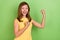 Photo of young cherful lady celebrate success fists hands awesome discount  over green color background