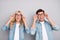 Photo of young couple happy positive smile hands touch eyeglasses vision look empty space isolated over grey color