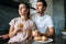 Photo of young couple starting the day together with coffee