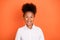 Photo of young excited african girl happy positive smile amazed shocked information isolated over orange color