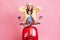 Photo of young excited amazed girl woman female hold hands head ride red motobike isolated on pink color background
