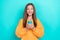 Photo of young excited cute little schoolgirl wear orange sweatshirt hold smartphone got million followers isolated on