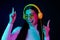 Photo of young excited girl happy positive smile dance nightclub headphones hipster isolated over neon color background