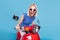 Photo of young excited girl happy positive smile drive motorbike wear sunglass isolated over blue color background