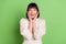 Photo of young excited girl happy positive smile hands touch cheeks surprised isolated over green color background