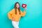 Photo of young excited popular teenager blogger hold red paper heart notification like her instagram account isolated on