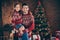 Photo of young family happy positive smile dad daddy daughter carry evergreen tree atmosphere xmas magic indoors