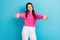 Photo of young friendly teenager schoolgirl wear pink knitwear sweater want hug you positive person embrace isolated on