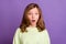 Photo of young girl amazed shock surprised omg wow reaction stupor information isolated over purple color background