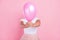 Photo of young girl close cover face air balloon anonym incognito  over pastel color background