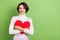 Photo of young girl happy positive smile hug embrace red paper heart dream look empty space isolated over green color