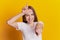 Photo of young girl have fun point finger joking fooling mocking isolated on vivid yellow colored background