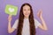 Photo of young girl hold reaction icon like show ok gesture isolated over purple background