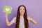 Photo of young girl hold reaction icon like show thumbup gesture isolated over purple background