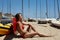 Photo Young Girl Making Chill Time Beach.Fitness Active Woman Spending Relax After Yaht Session Open Sea.Summer Season