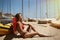 Photo Young Girl Making Chill Time Beach.Fitness Active Woman Spending Relax After Yaht Session Open Sea.Summer Season