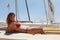 Photo Young Girl Making Chill Time Ocean Beach.Fitness Active Woman Spending Relax After Yaht Session Open Sea.Summer