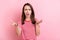 Photo of young girl unhappy angry displeased conflict argument disagreement isolated over pink color background