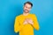 Photo of young guy happy positive smile hands on chest appreciate thankful isolated over blue color background