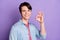 Photo of young guy happy positive smile show okey perfect great sign decision isolated over violet color background