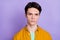 Photo of young handsome man serious confident concentrated focused calm isolated over violet color background