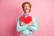 Photo of young happy positive funky funny smiling cheerful gentleman hug big red heart isolated on pink color background