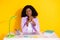 Photo of young happy representative afro businesswoman sit table having job interview isolated on yellow color