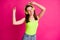 Photo of young happy woman enjoy listen music earphones dance relax isolated over pink color background