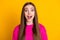 Photo of young lady long hairdo excited open mouth wear pink pullover isolated yellow color background