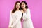 Photo of Young Lesbian asian women posing in concept of lgbtq couple  on pink background