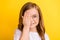 Photo of young little girl happy positive smile cover eye hand check-in vision oculist  over yellow color