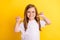 Photo of young little girl happy positive smile point thumbs herself proud winner  over yellow color background