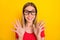 Photo of young lovely excited girl eyewear reaction information isolated over yellow color background