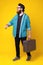 Photo of young man with beard walking with suitcase, going for travel